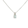 Sterling silver pendant with an emerald-cut pale blue aquamarine in a four-prong solitaire setting.