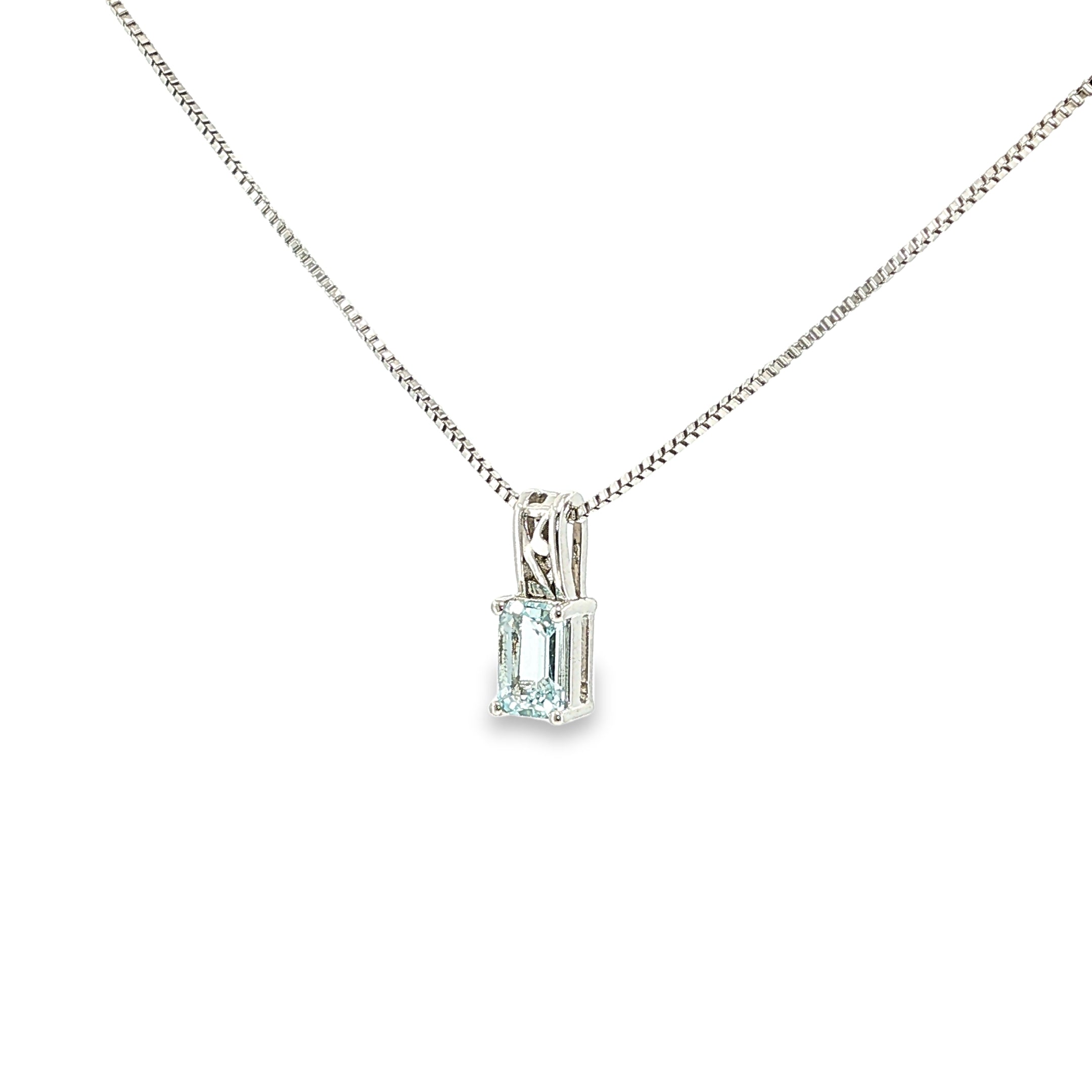 Sterling silver pendant with an emerald-cut pale blue aquamarine in a four-prong solitaire setting.