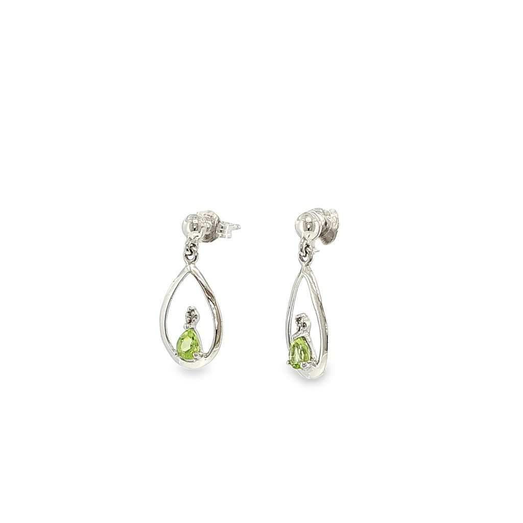 Sterling silver dangle earrings with pear-shaped green peridots suspended in open teardrop frames with diamond accents.