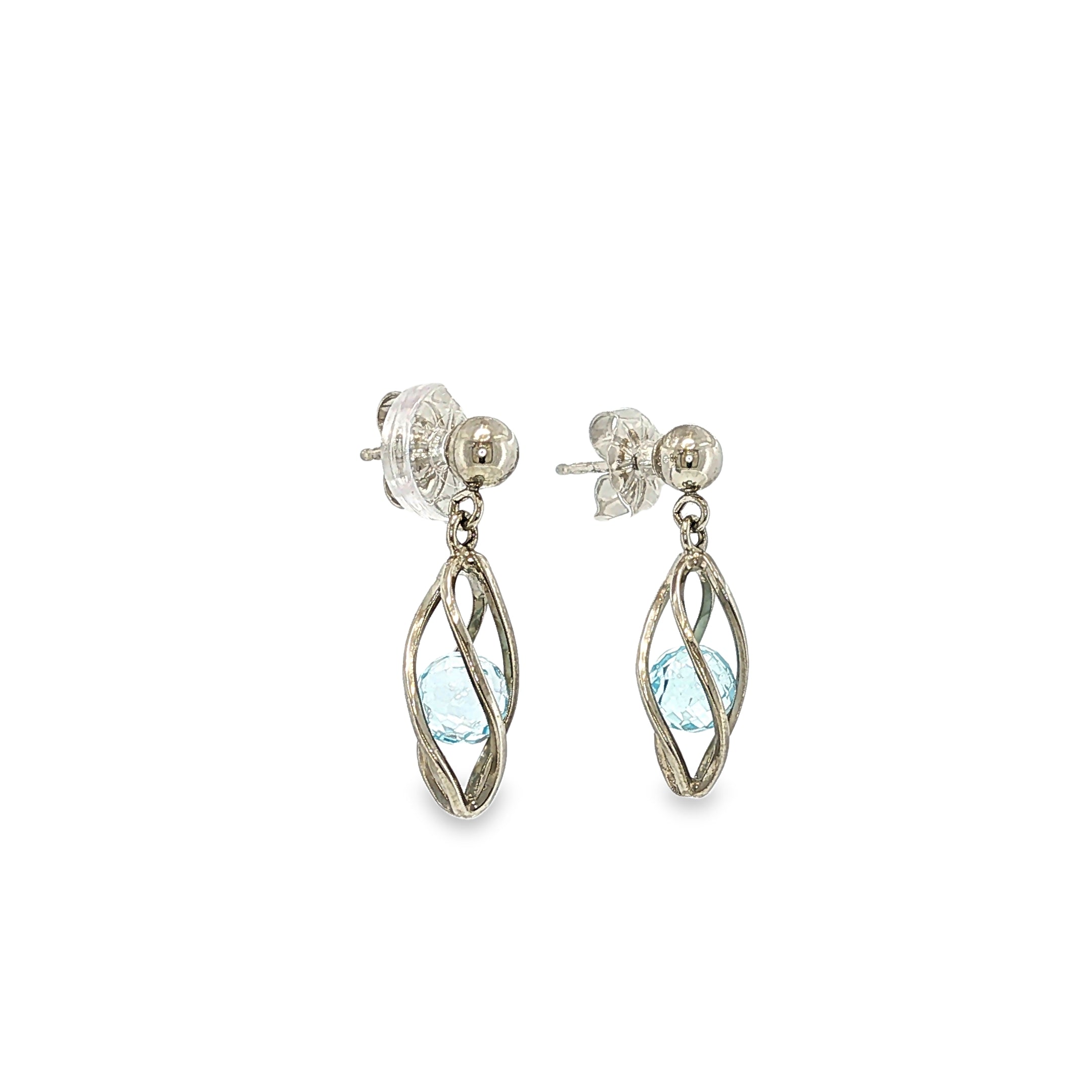 Sterling silver drop earrings with marquise blue topaz gemstones suspended inside open-cage designs.