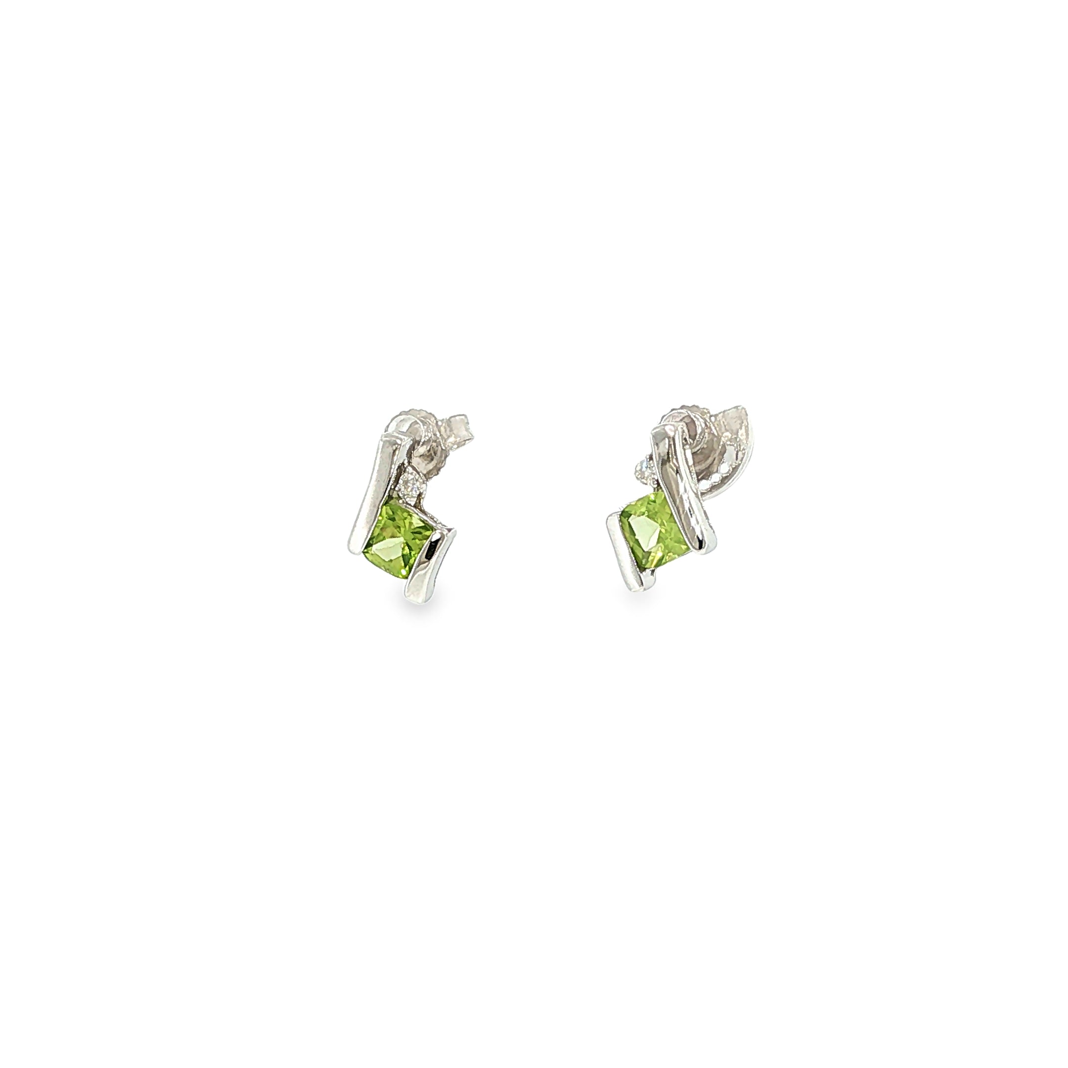Sterling silver stud earrings with cushion-cut green peridots framed by curved silver and diamond accents.