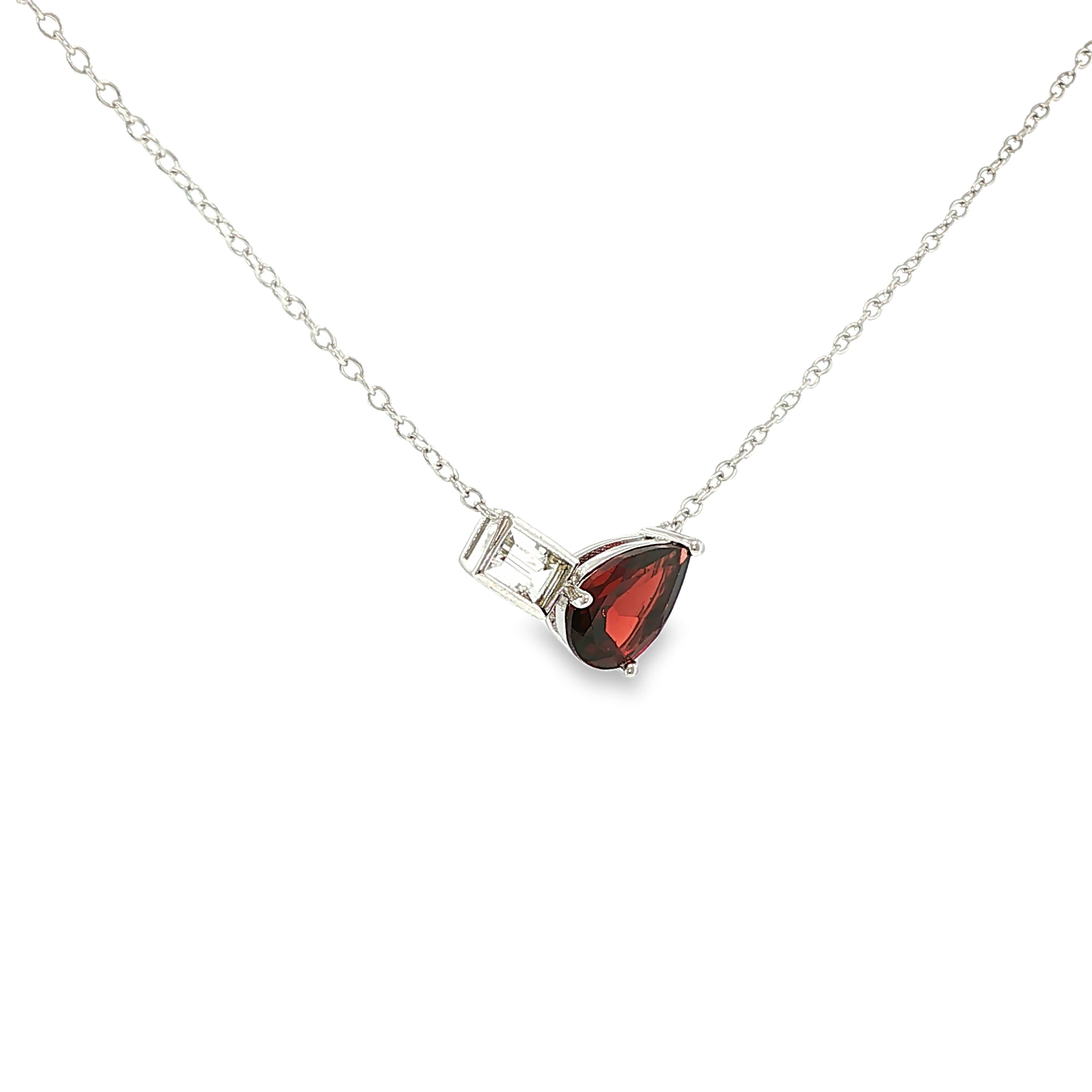 Sterling silver necklace with a pear-shaped red garnet and emerald-cut white topaz in an asymmetrical design.