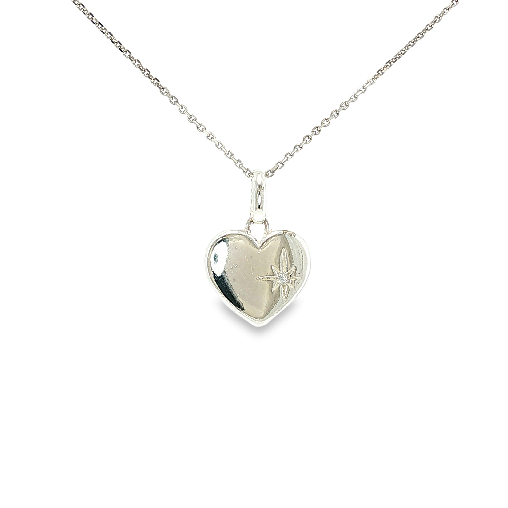 Polished sterling silver flat heart pendant with a small cubic zirconia accent.