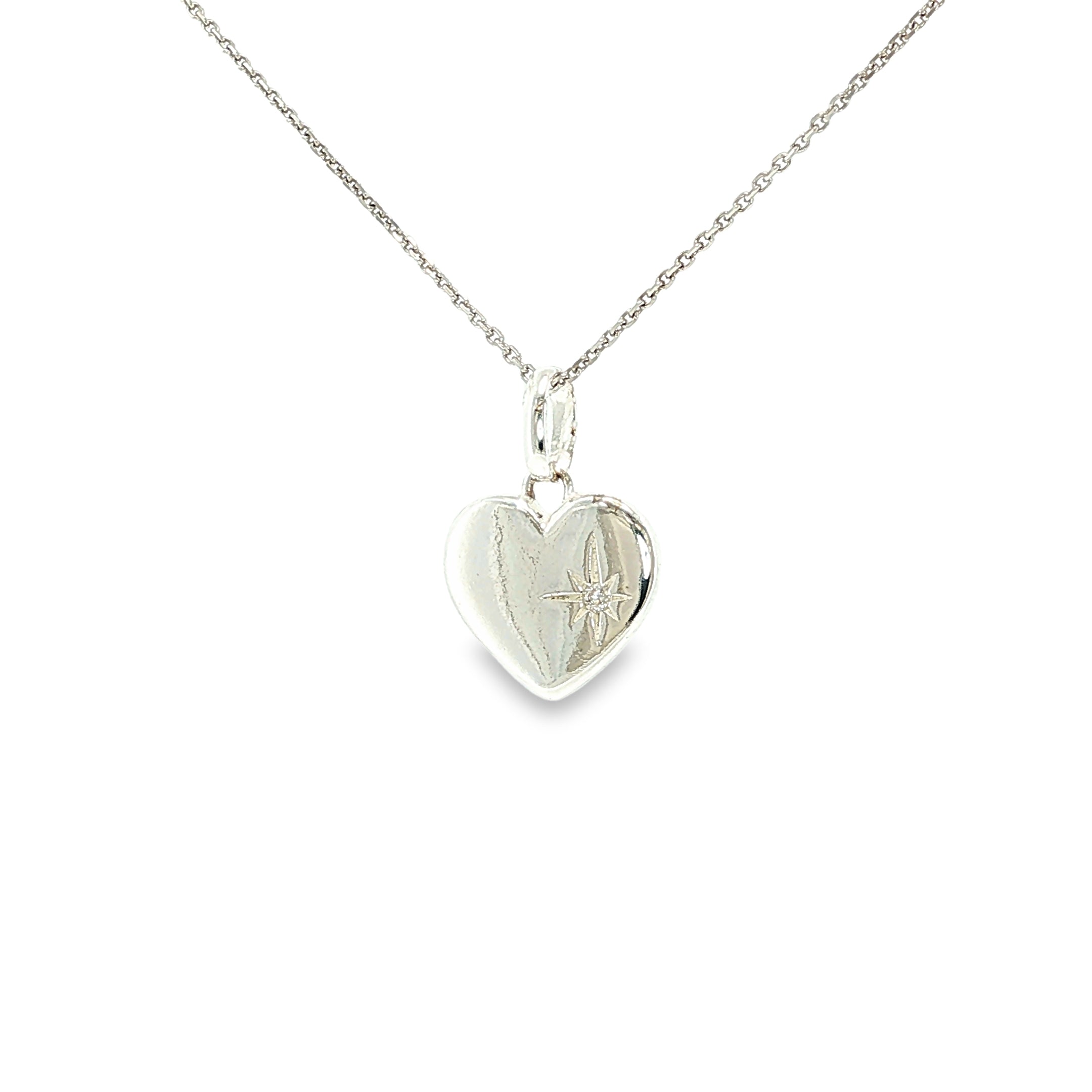 Polished sterling silver flat heart pendant with a small cubic zirconia accent.