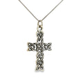Sterling silver cross pendant with an antiqued finish and intricate Celtic knot detailing.