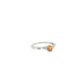 Sterling silver three-stone ring with an oval golden citrine center flanked by diamond accents.