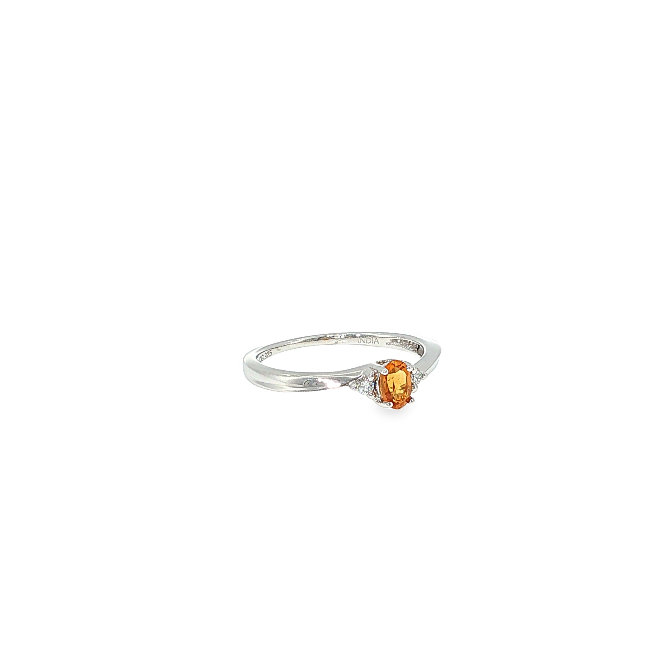Sterling silver three-stone ring with an oval golden citrine center flanked by diamond accents.