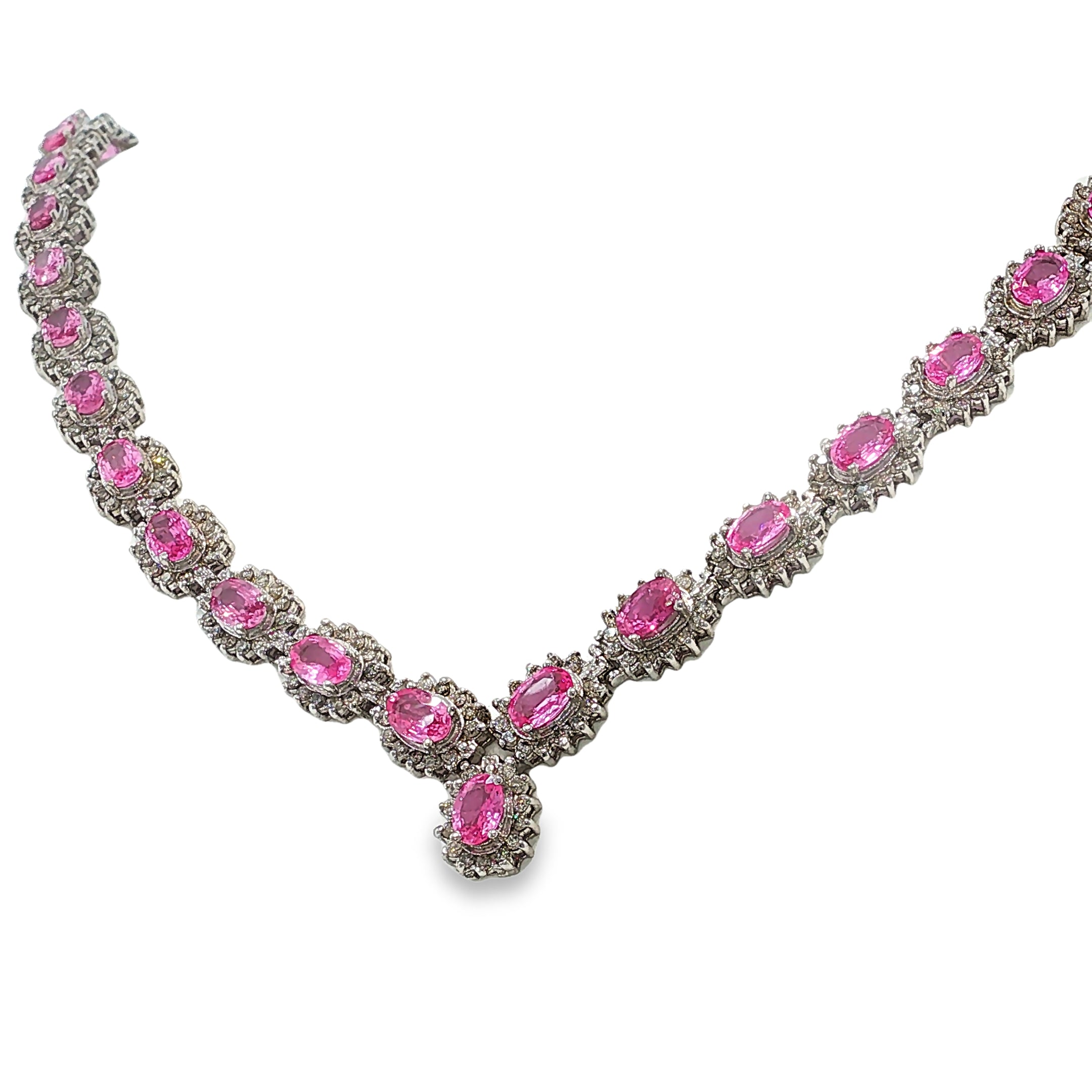 14K white gold pink sapphire and diamond necklace with oval pink sapphires, diamond halos, and a graduated center drop.