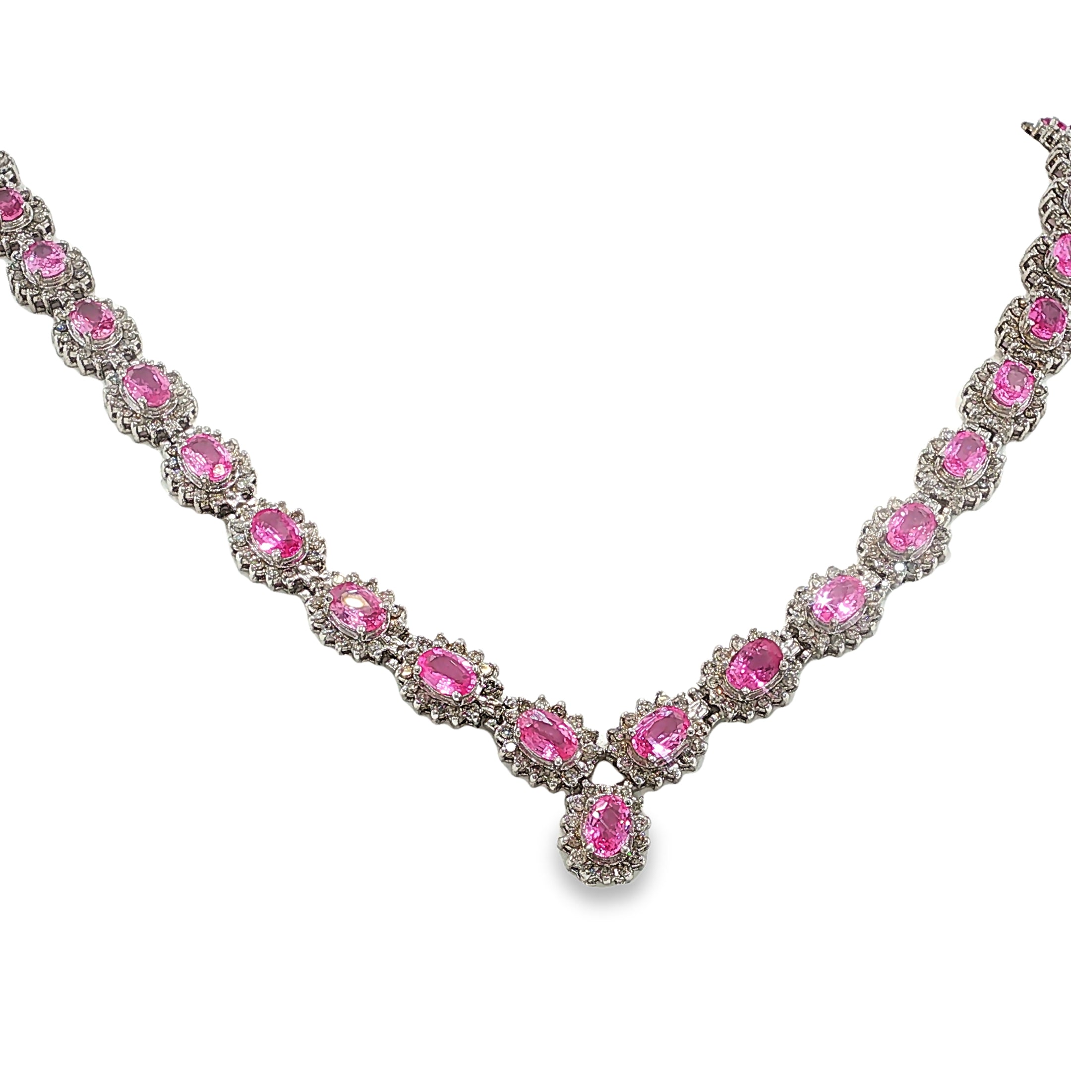 14K white gold pink sapphire and diamond necklace with oval pink sapphires, diamond halos, and a graduated center drop.
