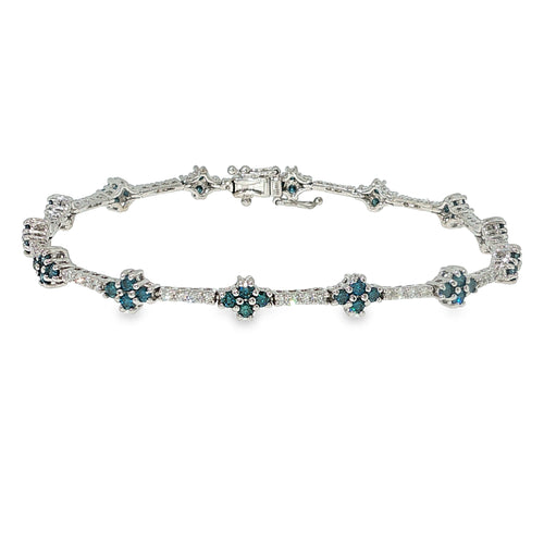 Blue and white diamond floral bracelet in 14K white gold with clustered flower-style diamond accents.