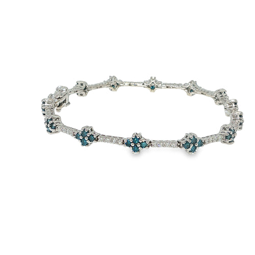 Blue and white diamond floral bracelet in 14K white gold with clustered flower-style diamond accents.