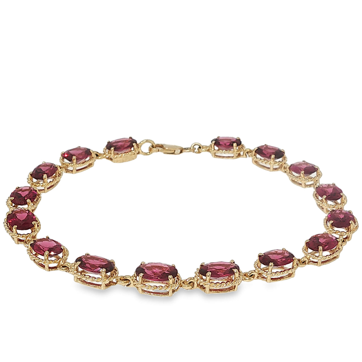 14K yellow gold bracelet with oval rhodolite garnets in decorative linked settings.
