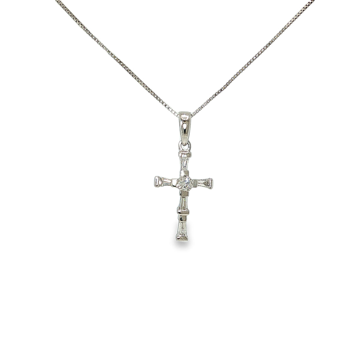Platinum diamond cross necklace with round brilliant and baguette diamonds on an 18-inch box chain.