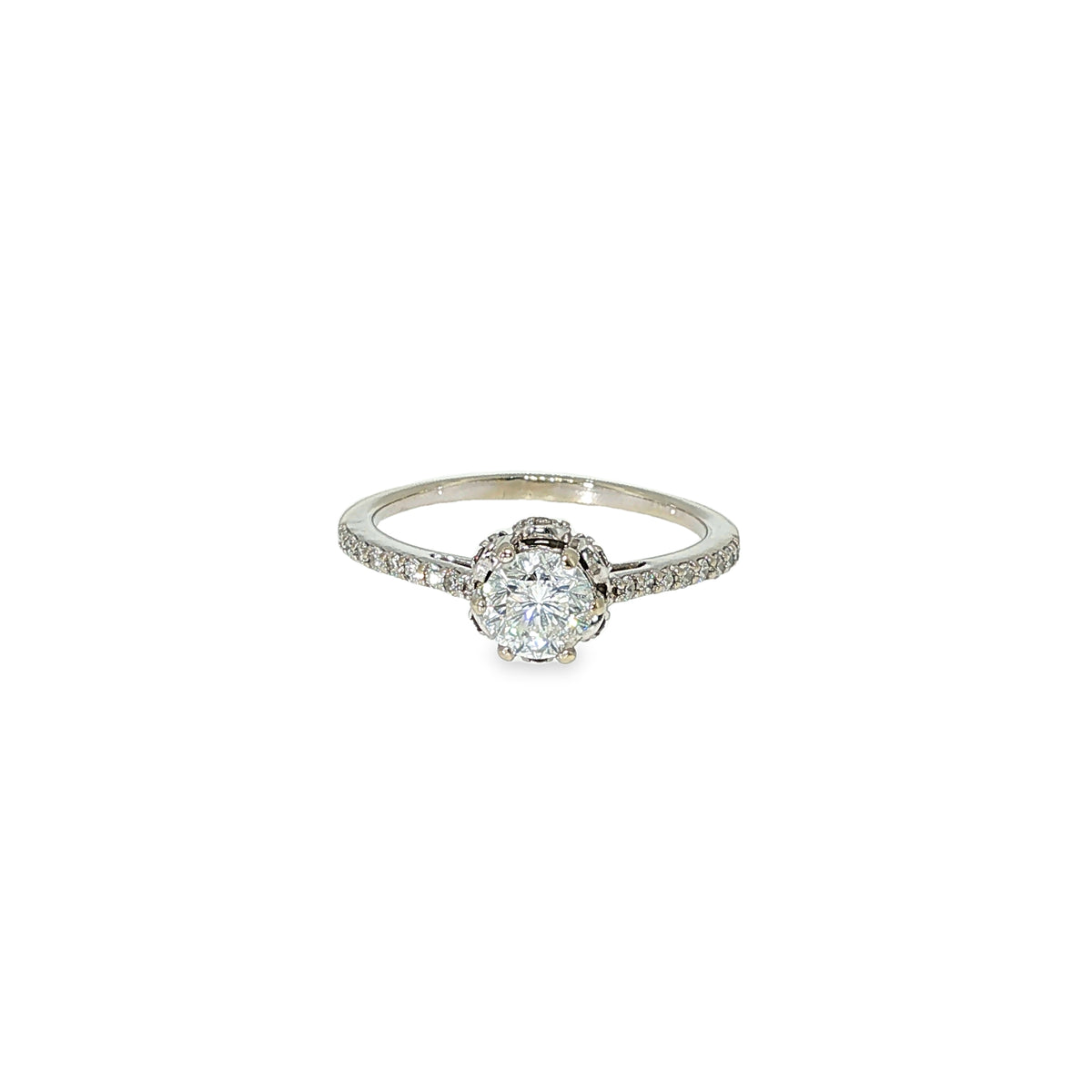 Round brilliant diamond engagement ring with a hidden halo and diamond-accented band in 14K white gold.