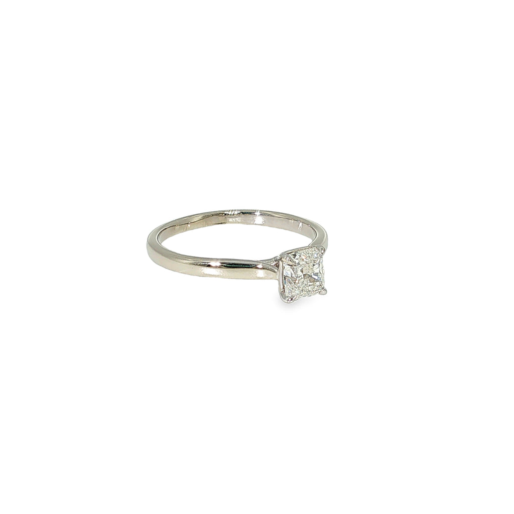 Natural radiant-cut diamond solitaire engagement ring in 14K white gold with a four-prong setting.