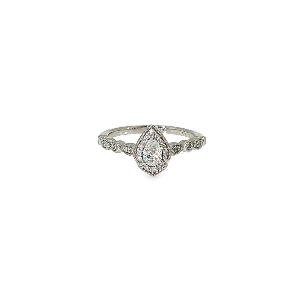 Pear-shaped diamond halo engagement ring in 14K white gold with round diamond accents along the band.