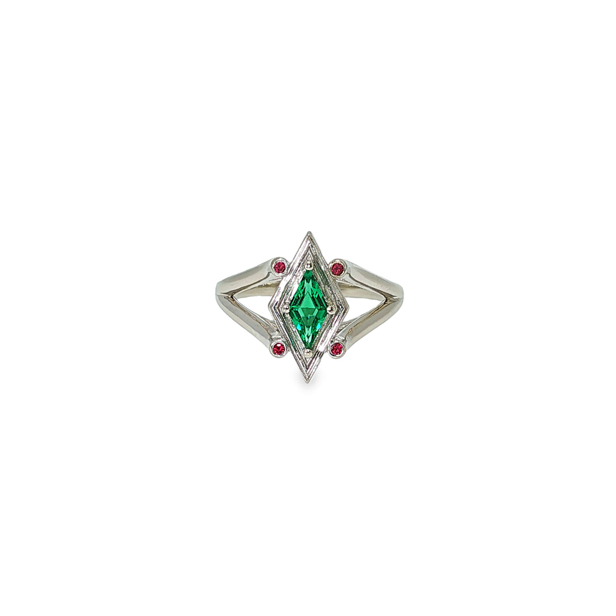 14K white gold geometric ring with a diamond-shaped lab-grown emerald and four small ruby accents.