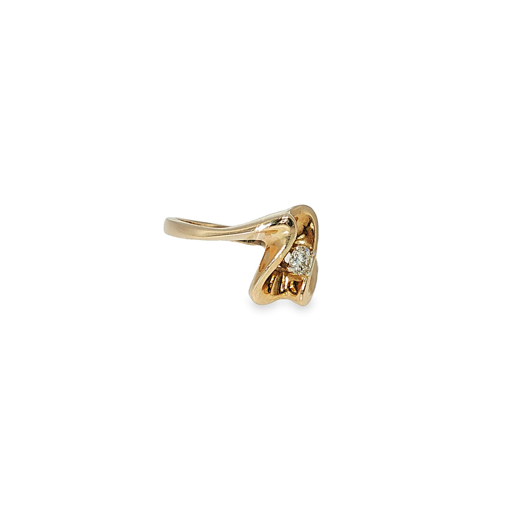 14K yellow gold freeform ring with a single round brilliant diamond in a sculptural asymmetrical design.