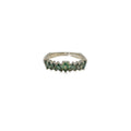 14K white gold graduated band set with nine green Montana sapphires in mixed shapes.