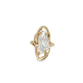 14K yellow gold freeform ring with an elongated freshwater baroque pearl in a sculptural openwork setting.