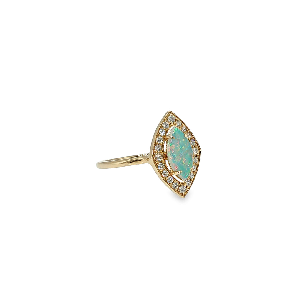 14K yellow gold ring with a marquise AAA opal surrounded by a diamond halo.