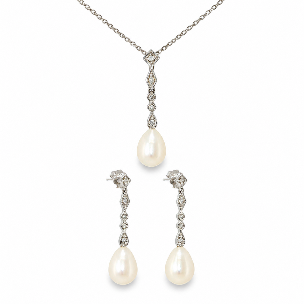 14K white gold freshwater pearl and diamond jewelry set with pear-shaped pearl drop necklace and matching earrings.