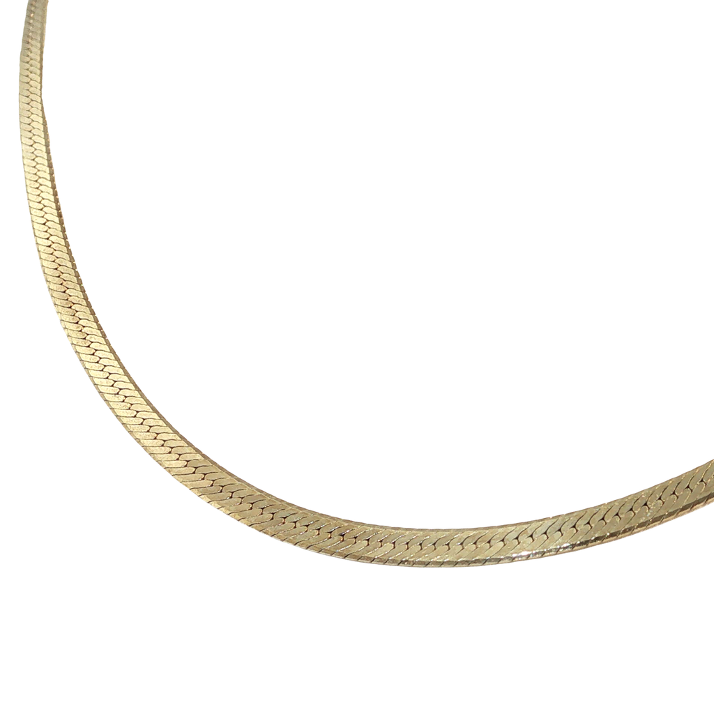 14K yellow gold slim herringbone chain necklace with a smooth polished finish.