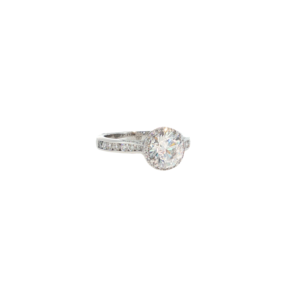 18K white gold Tacori ring with a round cubic zirconia center surrounded by diamond halo and setting accents.