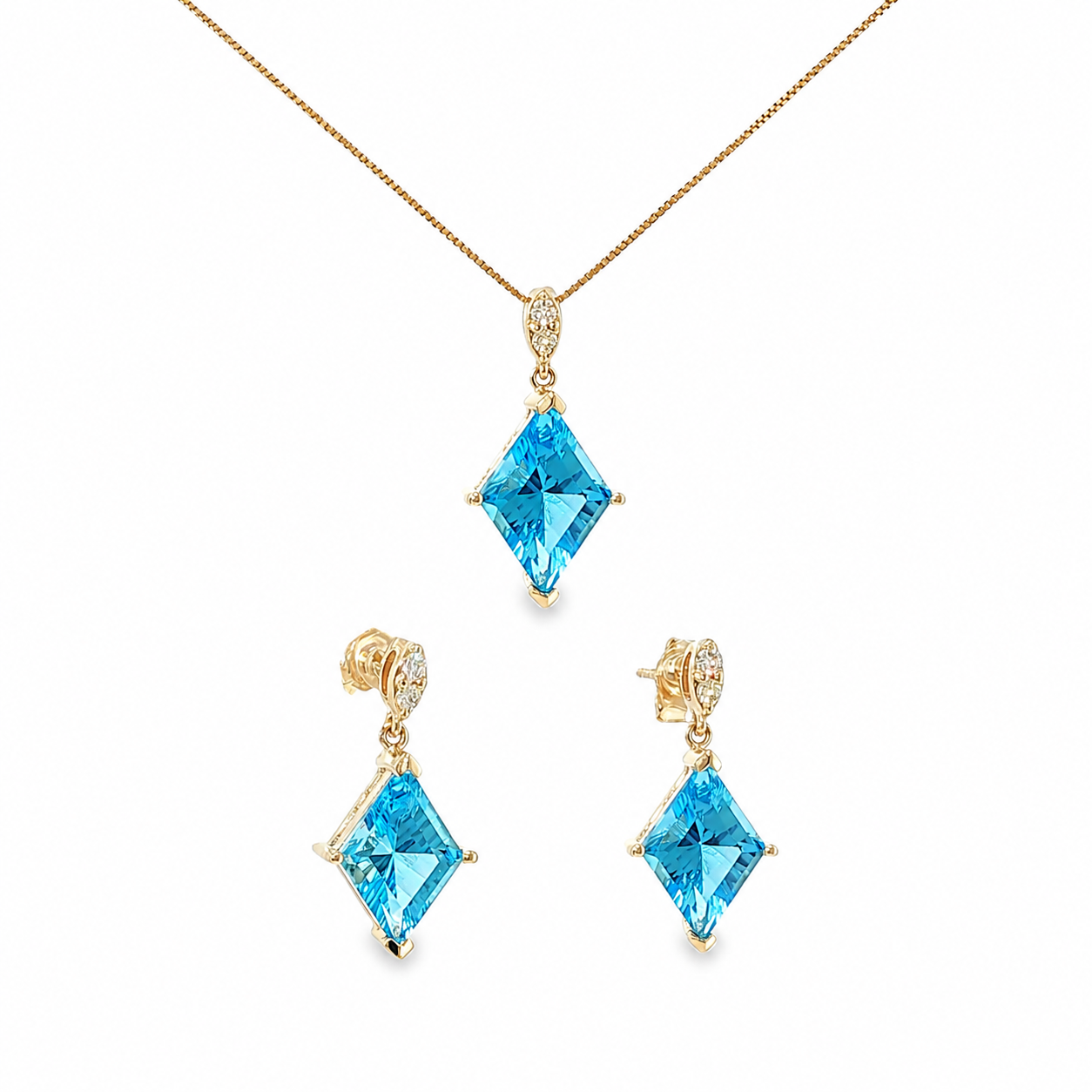 14K yellow gold matching pendant and drop earring set with kite-cut Swiss blue topaz gemstones and diamond accents.