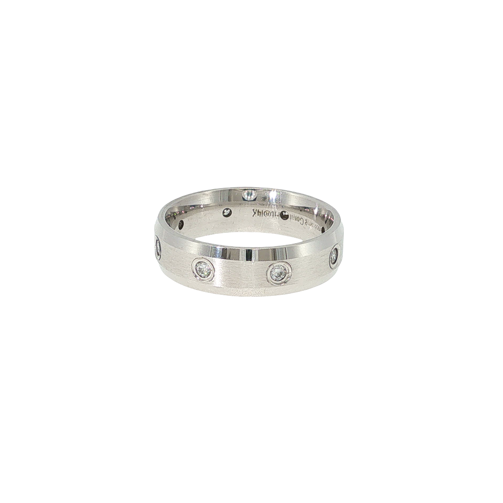 14K white gold comfort-fit band with beveled edges and eight flush-set round brilliant diamonds.