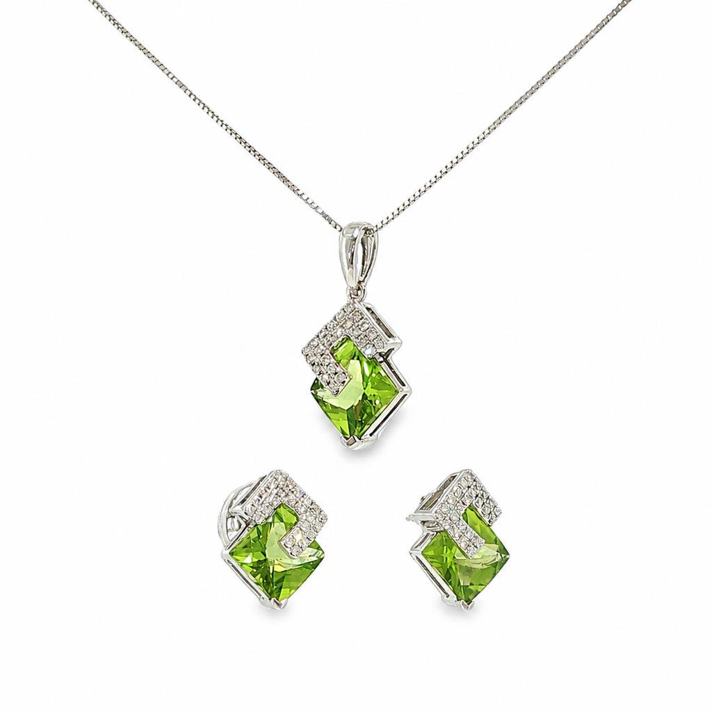 14K white gold matching pendant and earring set with vivid green peridot gemstones in angular geometric frames accented with diamonds.