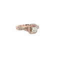14K rose gold halo ring with a cushion-cut center diamond surrounded by round diamond accents.