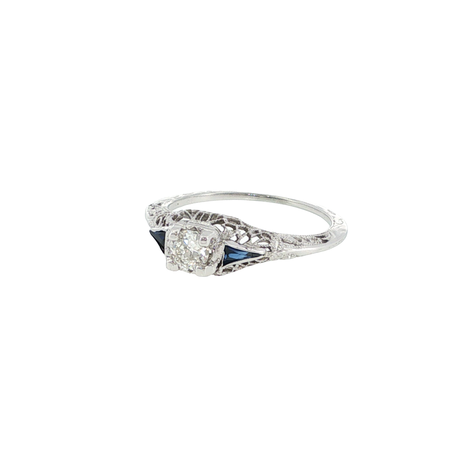 18K white gold vintage-style ring with an Old European cut diamond center and deep blue synthetic sapphire accents.