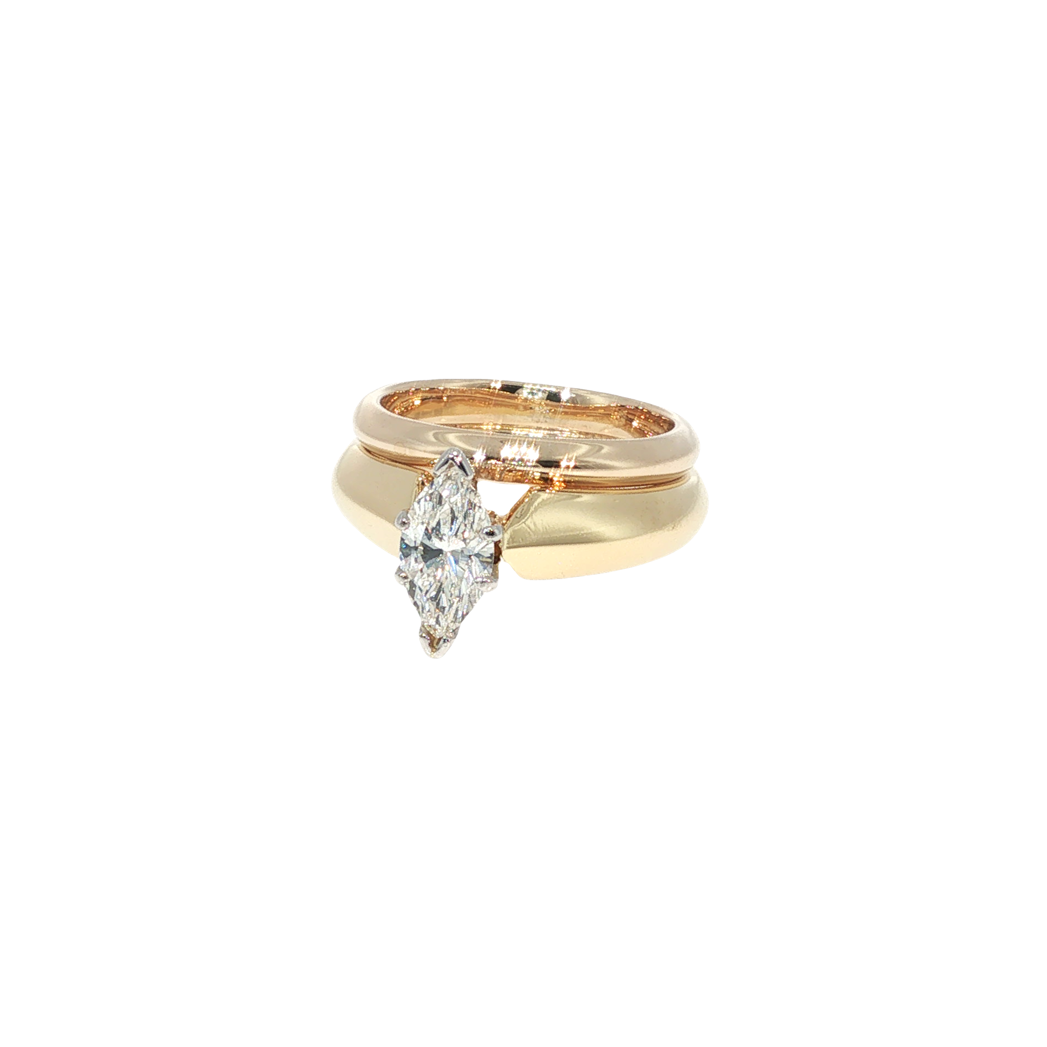 18K yellow gold wedding set centered with a marquise-cut diamond and coordinating gold bands.