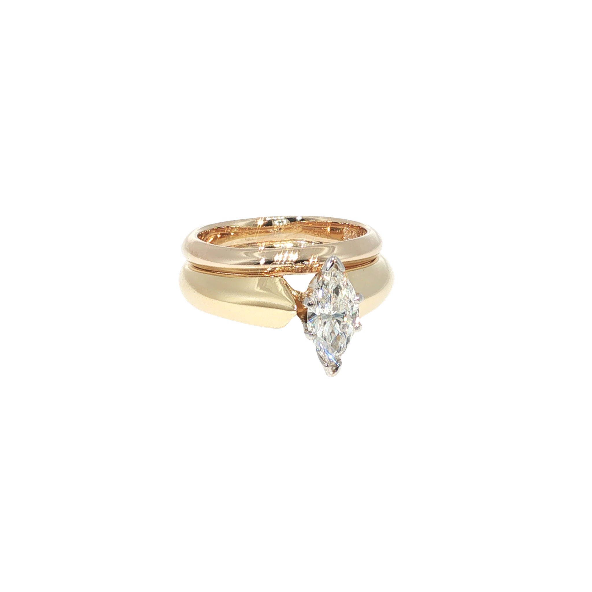 18K yellow gold wedding set centered with a marquise-cut diamond and coordinating gold bands.
