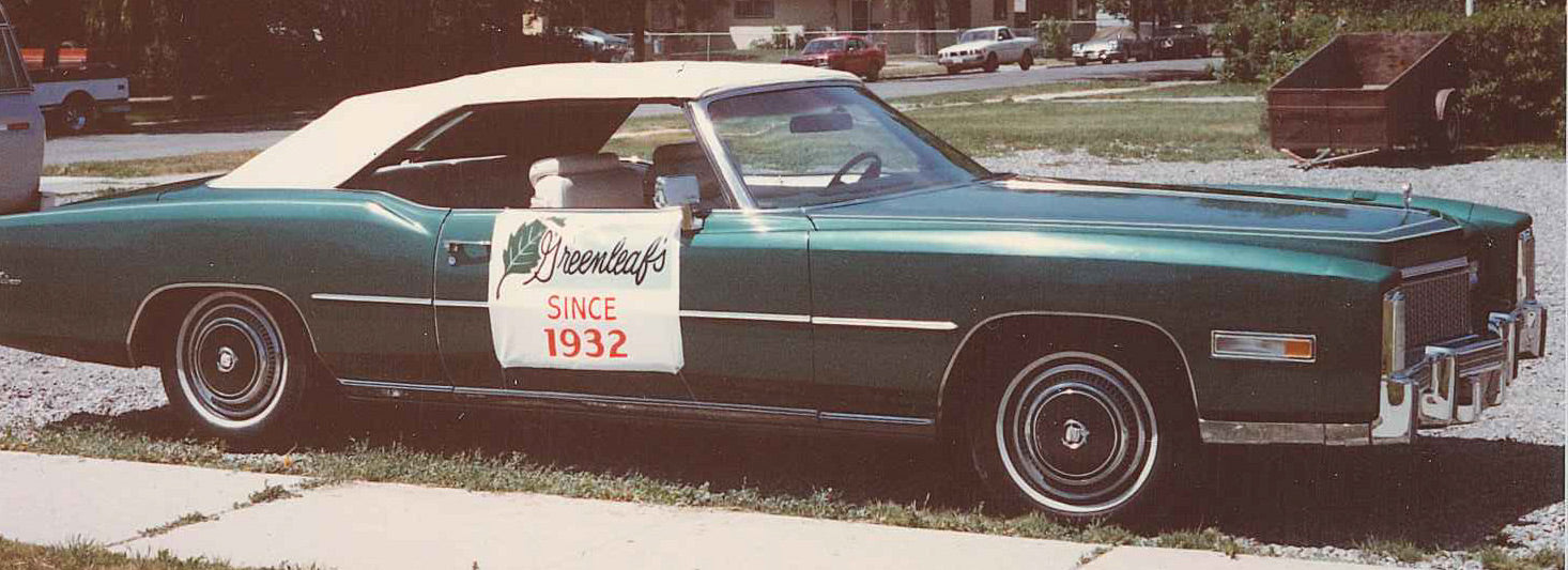 Vintage Greenleaf’s Jewelry convertible with a Since 1932 sign