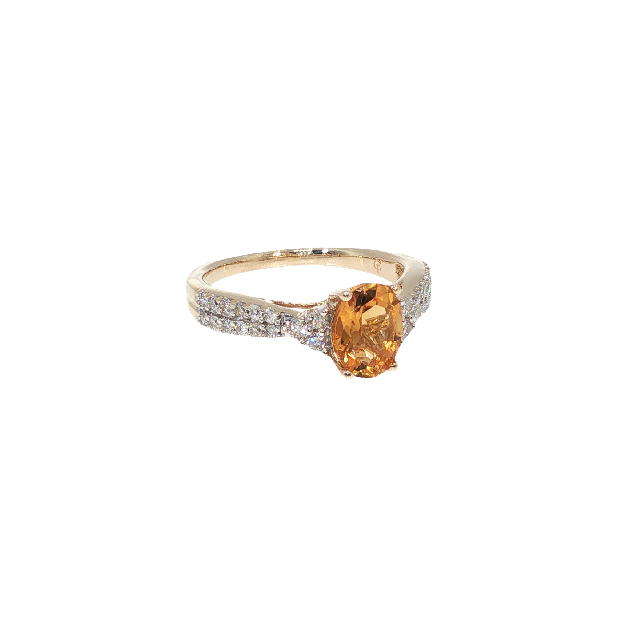 10K yellow gold ring with an oval golden citrine surrounded by a halo of round brilliant diamonds.