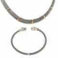 Sterling silver and 18K yellow gold matching set with a textured popcorn link necklace and sculpted diamond-accented panther cuff bracelet.