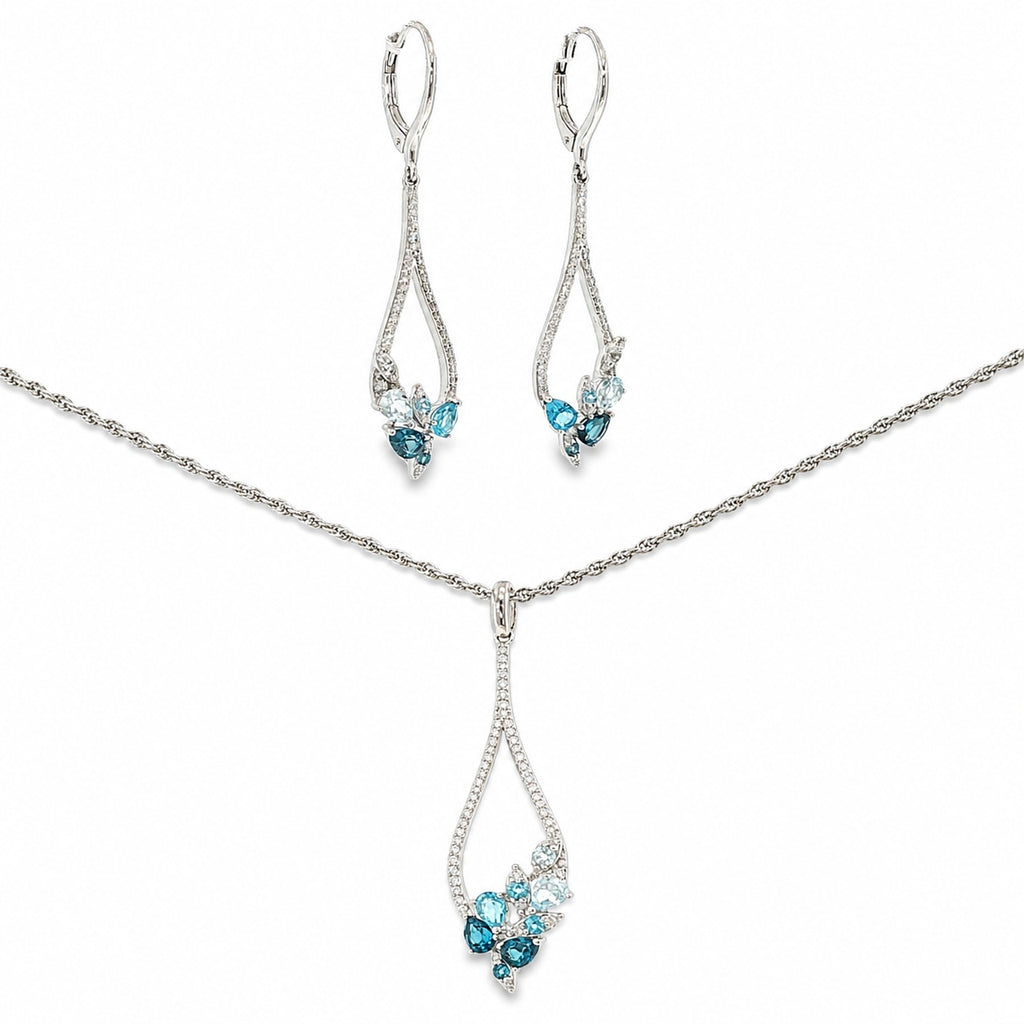 14K white gold matching necklace and dangle earring set with sky blue, Swiss blue and London blue topaz framed by diamond accents.