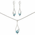 14K white gold matching necklace and dangle earring set with sky blue, Swiss blue and London blue topaz framed by diamond accents.