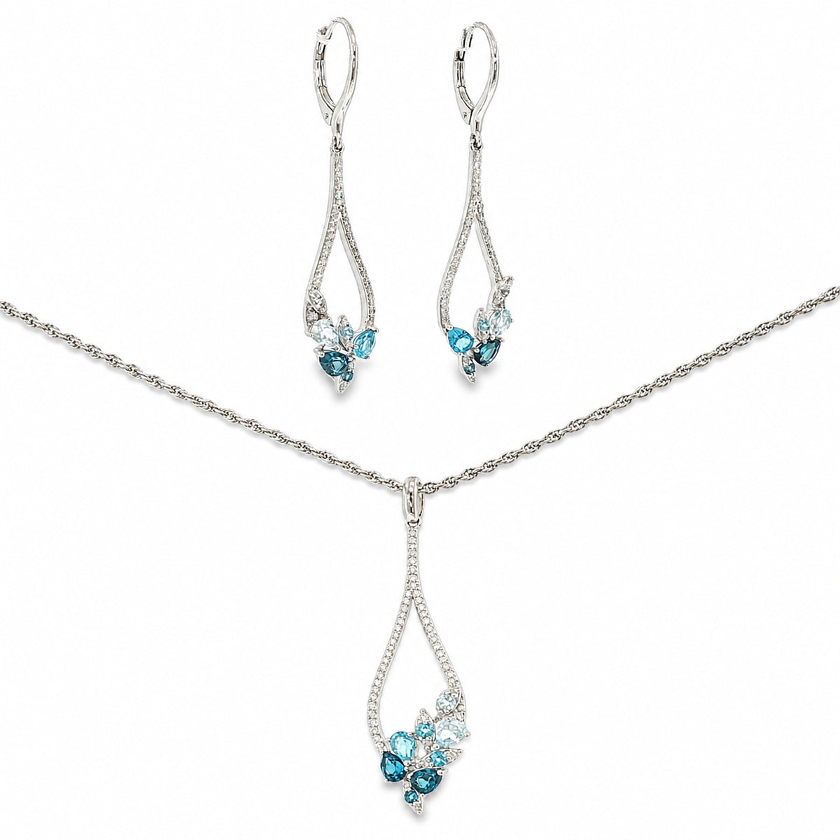 14K white gold matching necklace and dangle earring set with sky blue, Swiss blue and London blue topaz framed by diamond accents.