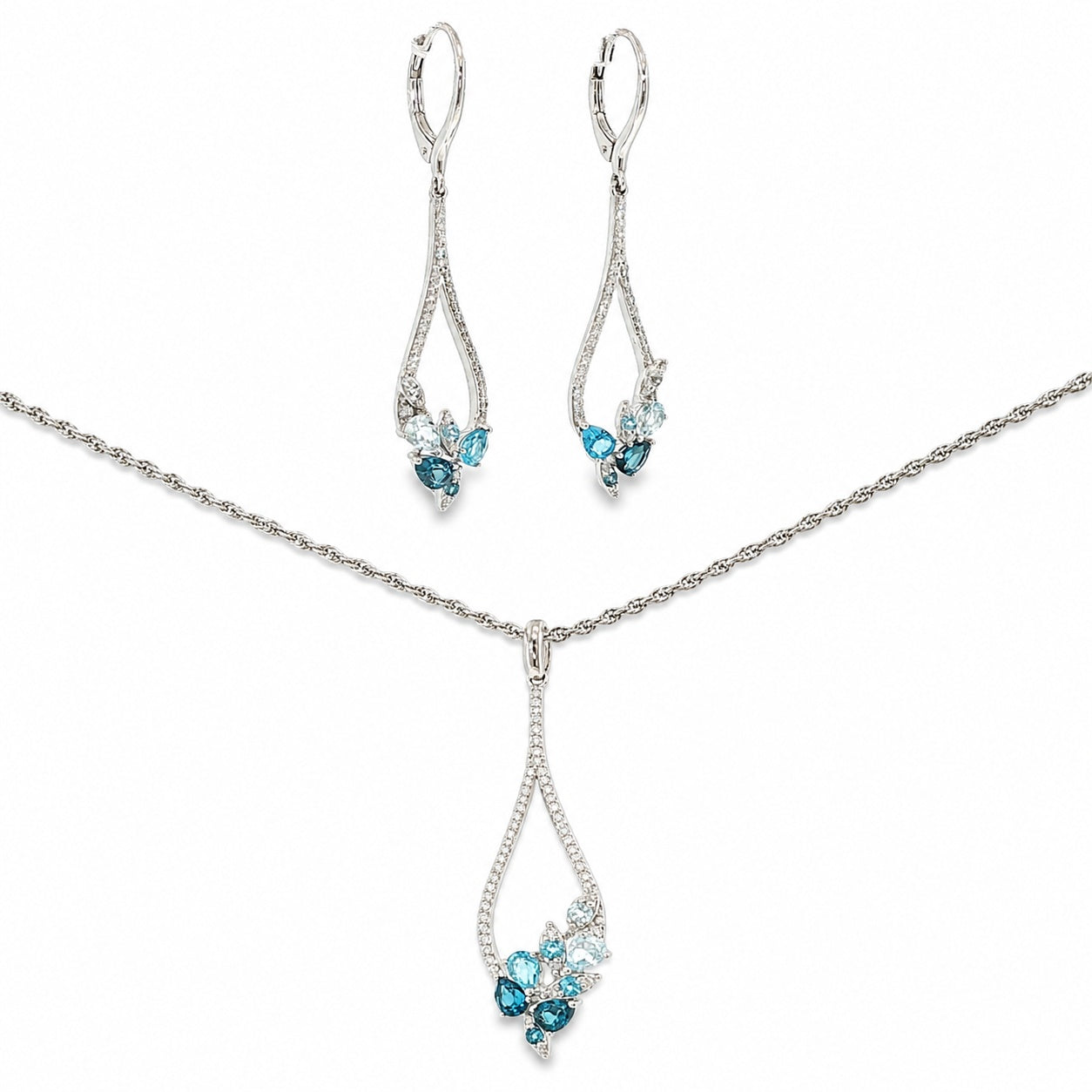14K white gold matching necklace and dangle earring set with sky blue, Swiss blue and London blue topaz framed by diamond accents.