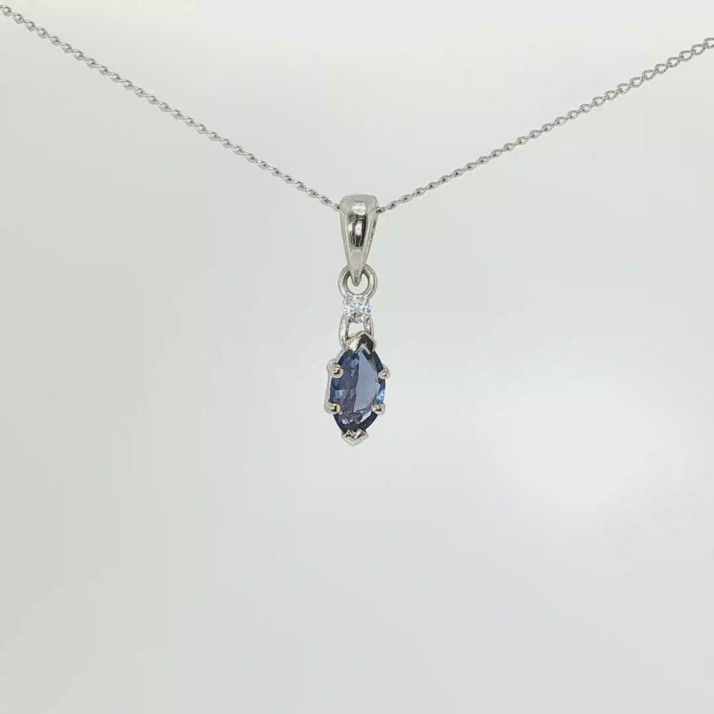 14K white gold pendant with a marquise Montana Yogo sapphire and single diamond accent.