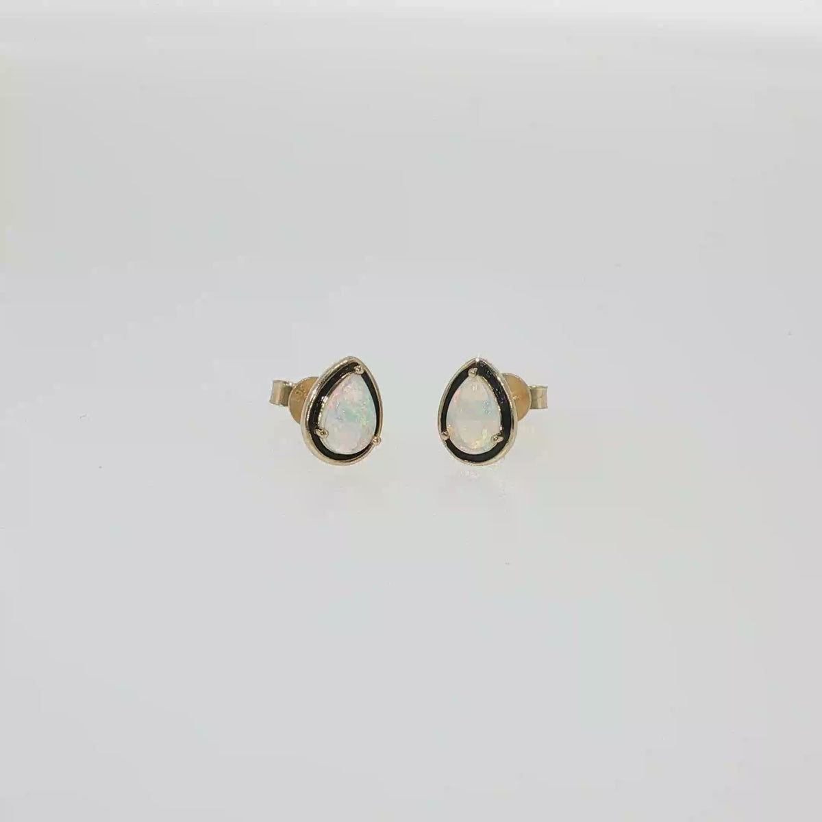 14K yellow gold stud earrings with two pear-shaped Australian opals.