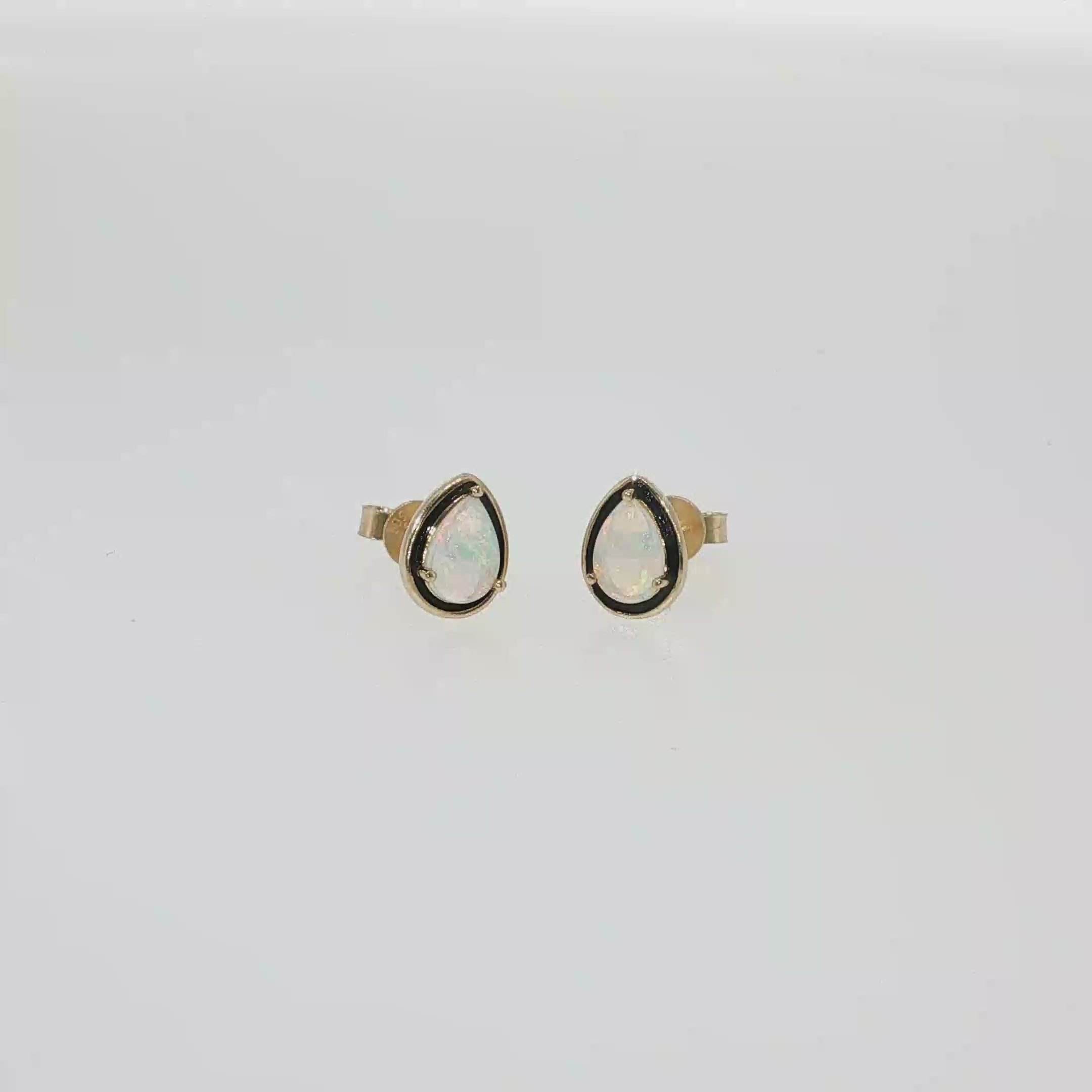 14K yellow gold stud earrings with two pear-shaped Australian opals.