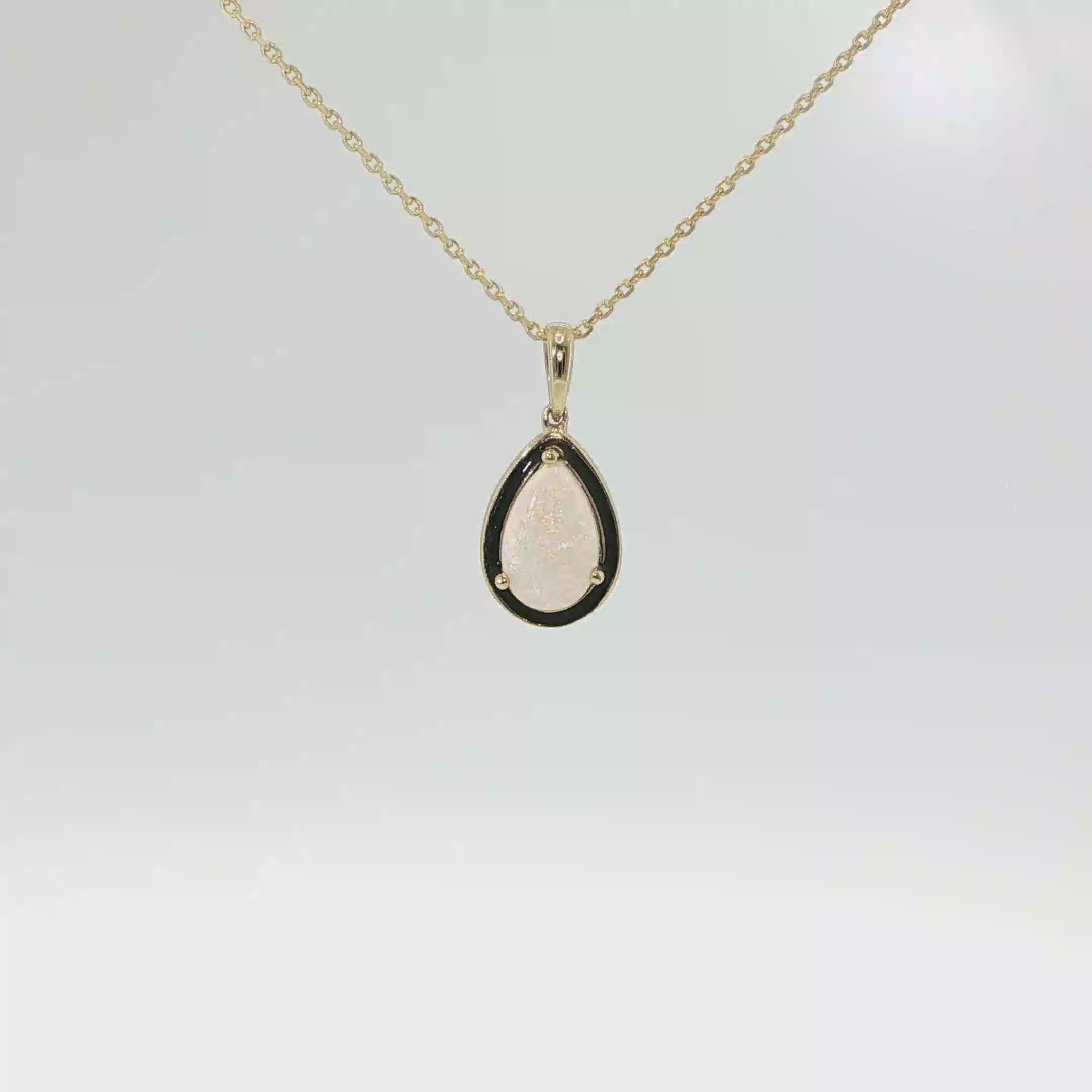 14K yellow gold pendant with a pear-shaped AAA Australian opal.