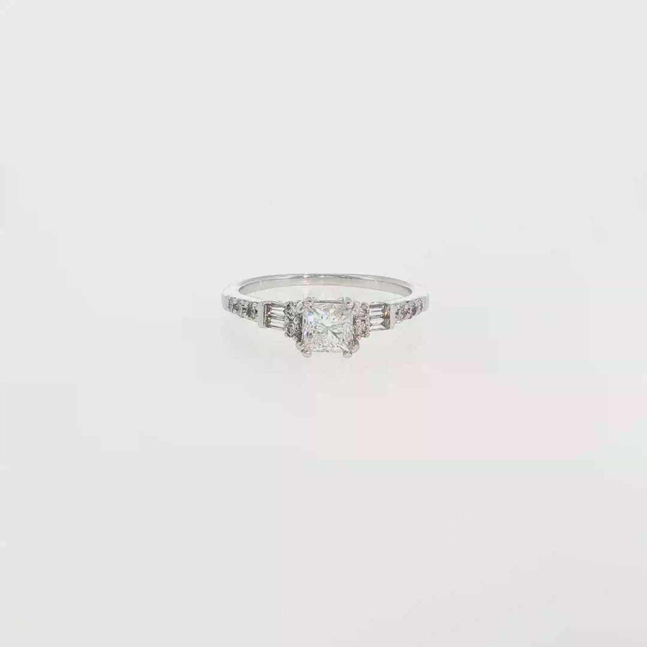 Round Diamond and Tapered Baguette Ring