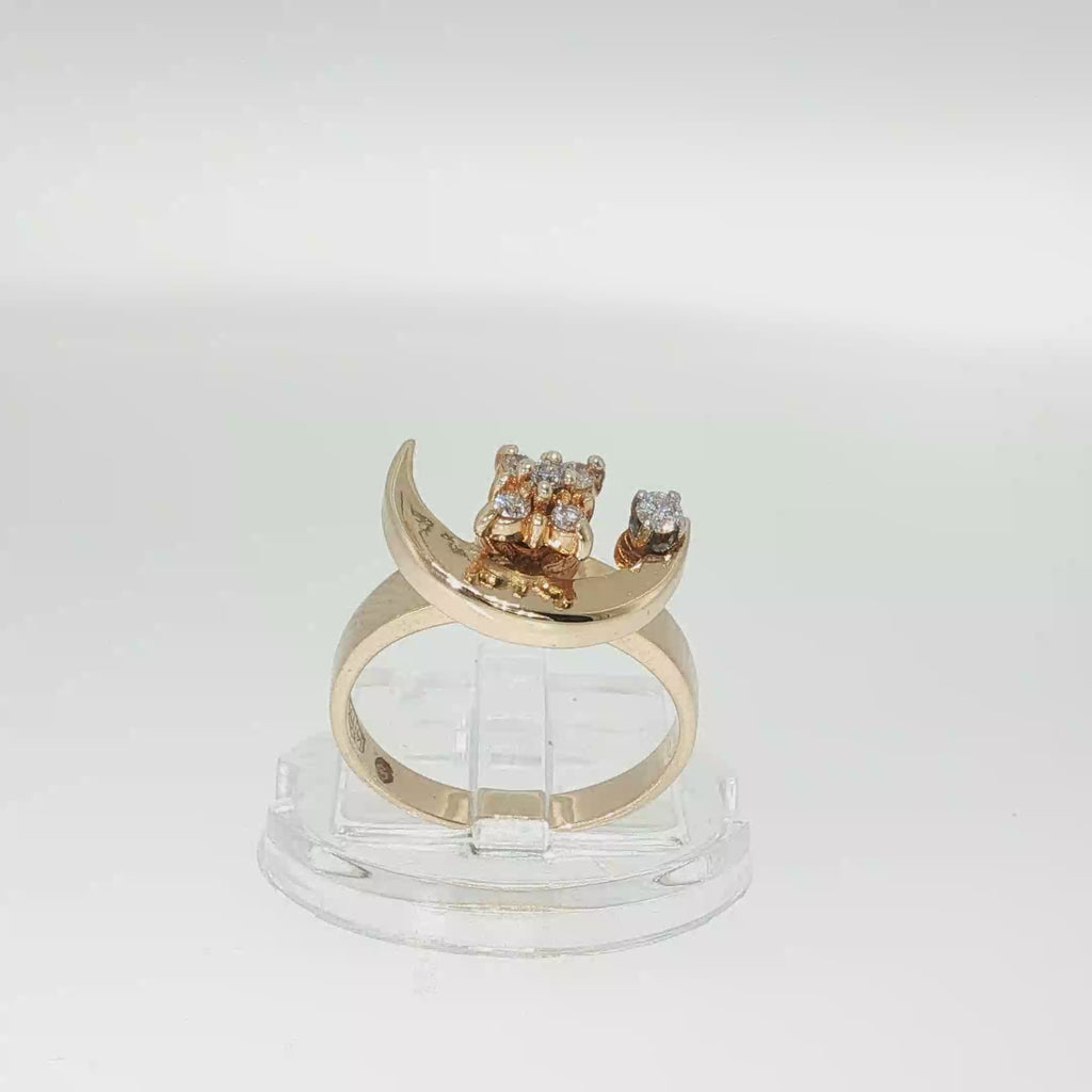 14K yellow gold diamond crescent moon ring with a swiveling moon design and round brilliant diamond accents.