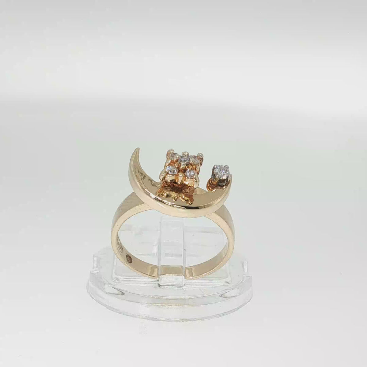 14K yellow gold diamond crescent moon ring with a swiveling moon design and round brilliant diamond accents.