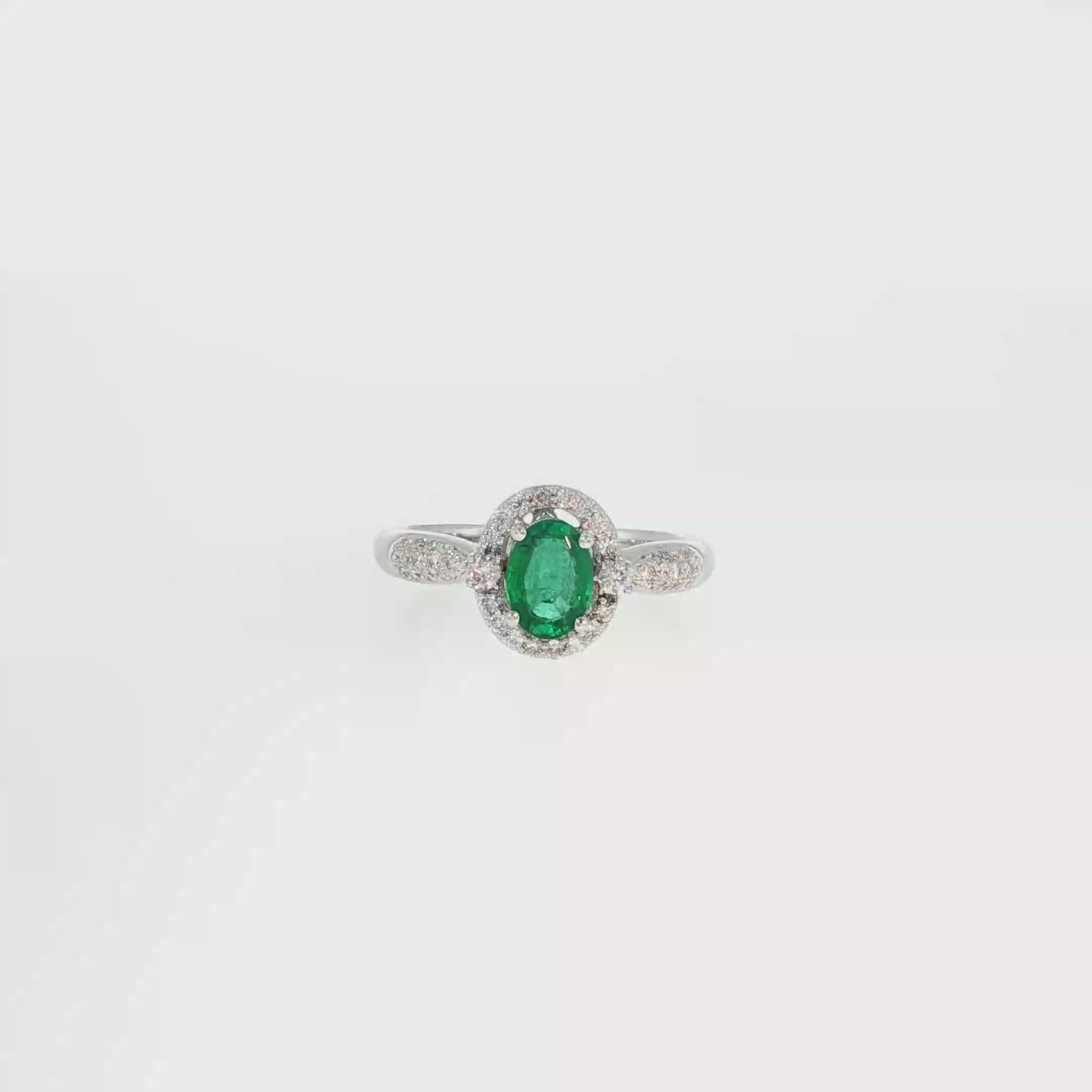 Oval Emerald and Diamond Halo Ring